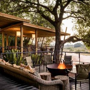 A burning fire on the main deck at Singita Ebony