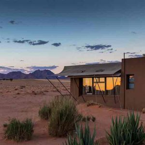 A small house on the edge of a desert in Namibia